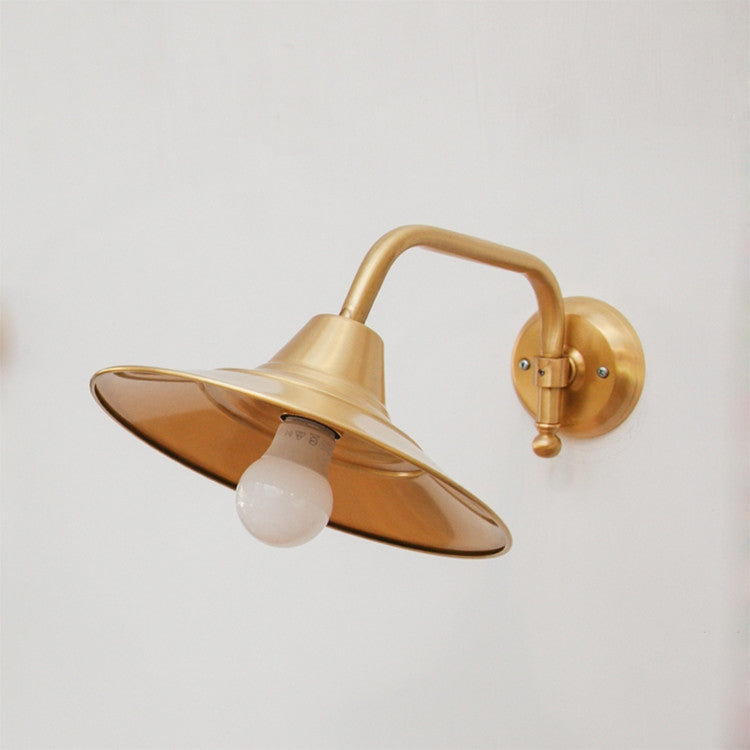 Beveled brass wall light