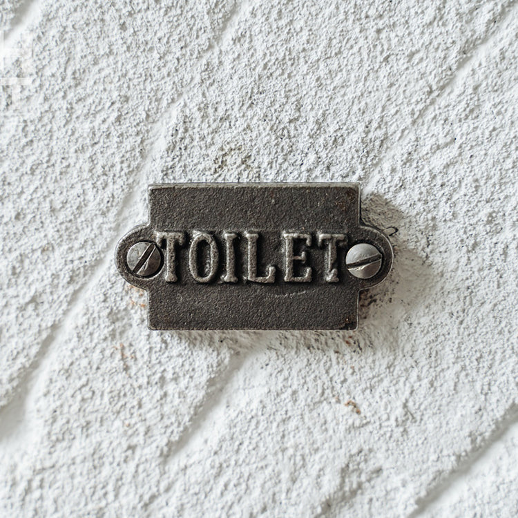 British cast iron toilet sign