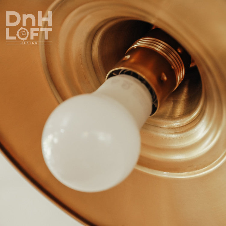 Beveled brass wall light