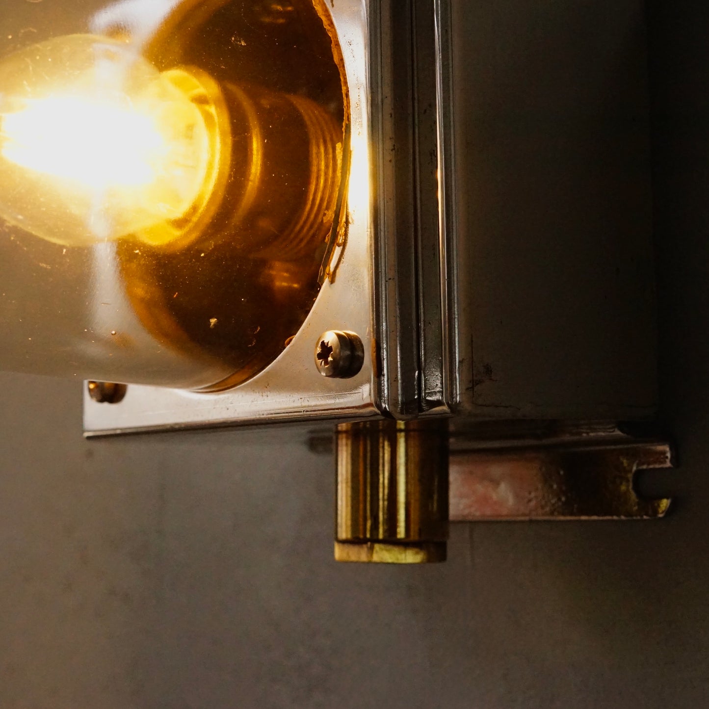 Cast iron upright wall light