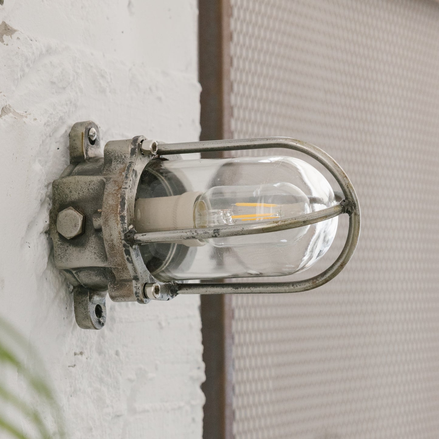 Cast iron upright wall light