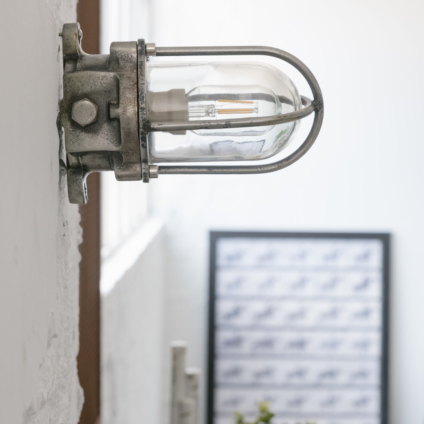 Cast iron upright wall light
