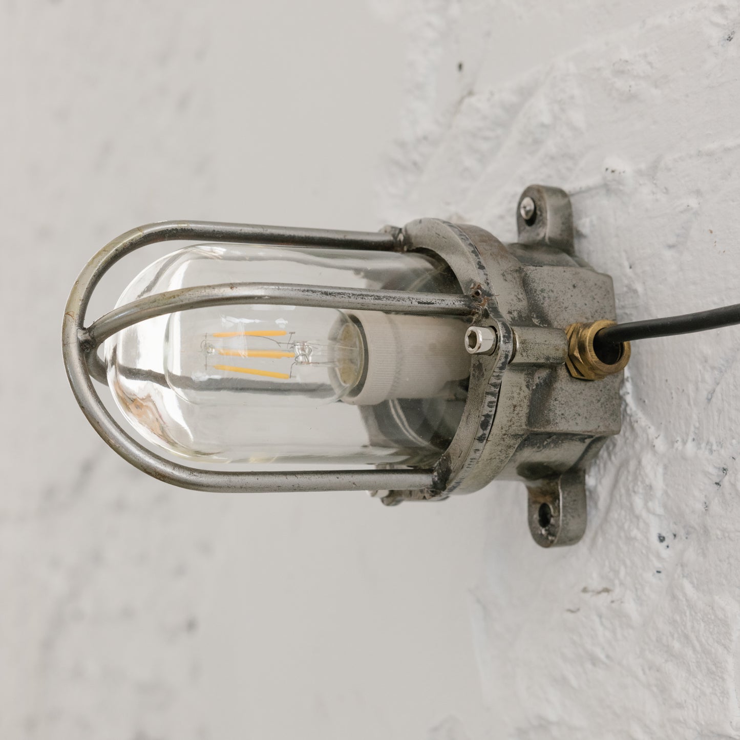 Cast iron upright wall light
