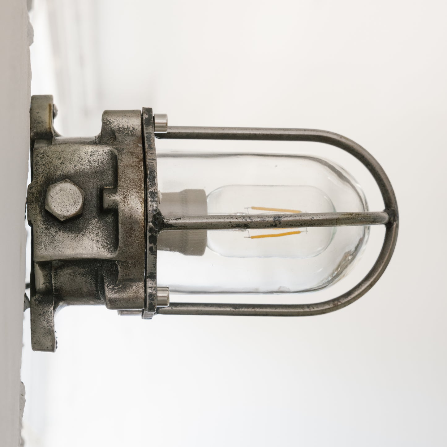 Cast iron upright wall light