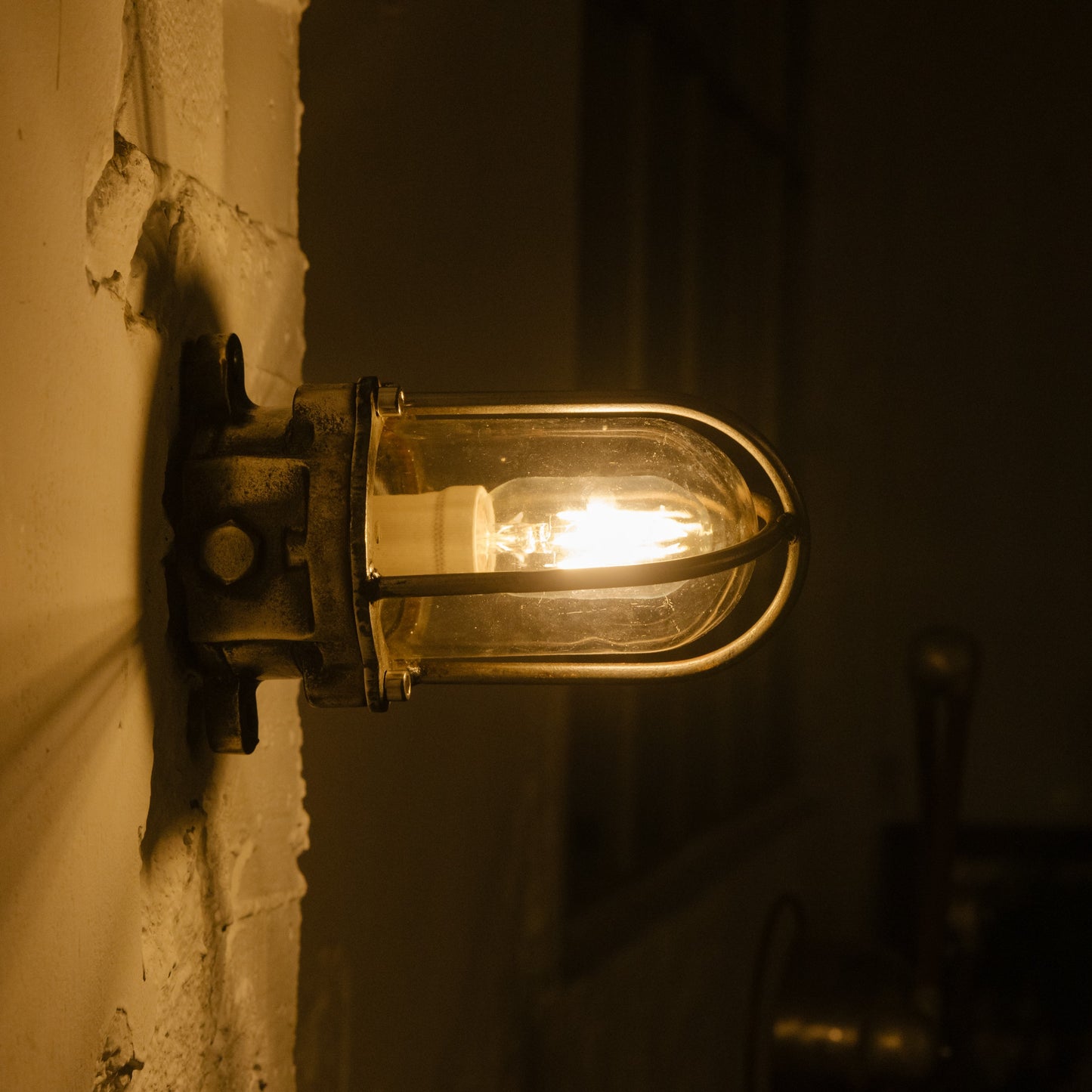 Cast iron upright wall light