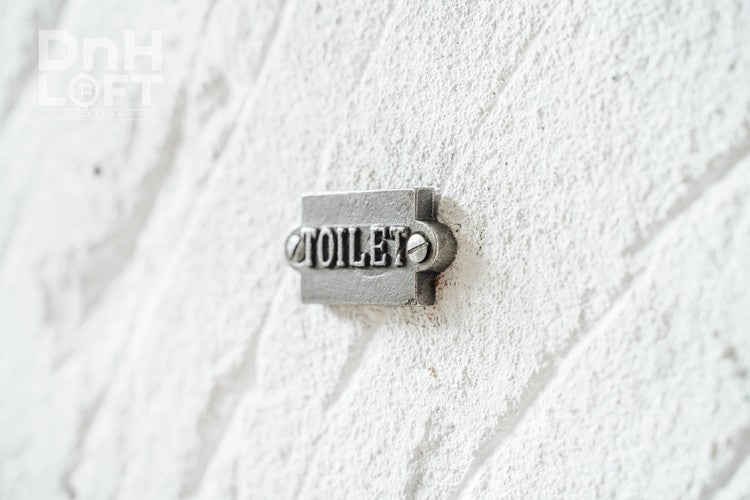 British cast iron toilet sign